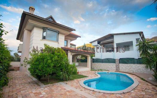 A luxury vacation home for sale in Marmaris Icmeler with a private swimming pool and garden